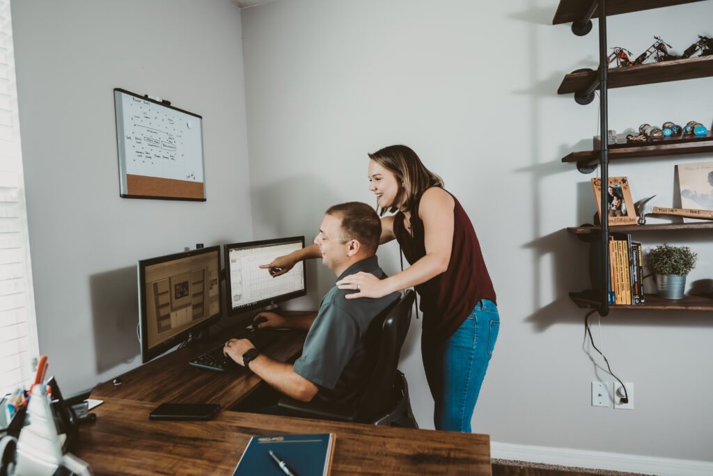 ali and steven at a computer